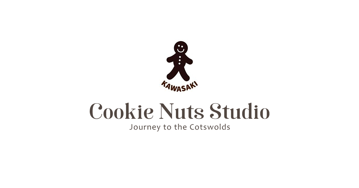 ジンジャーブレッドマンのロゴが描かれたクッキーナッツ・スタジオ川崎本店の看板